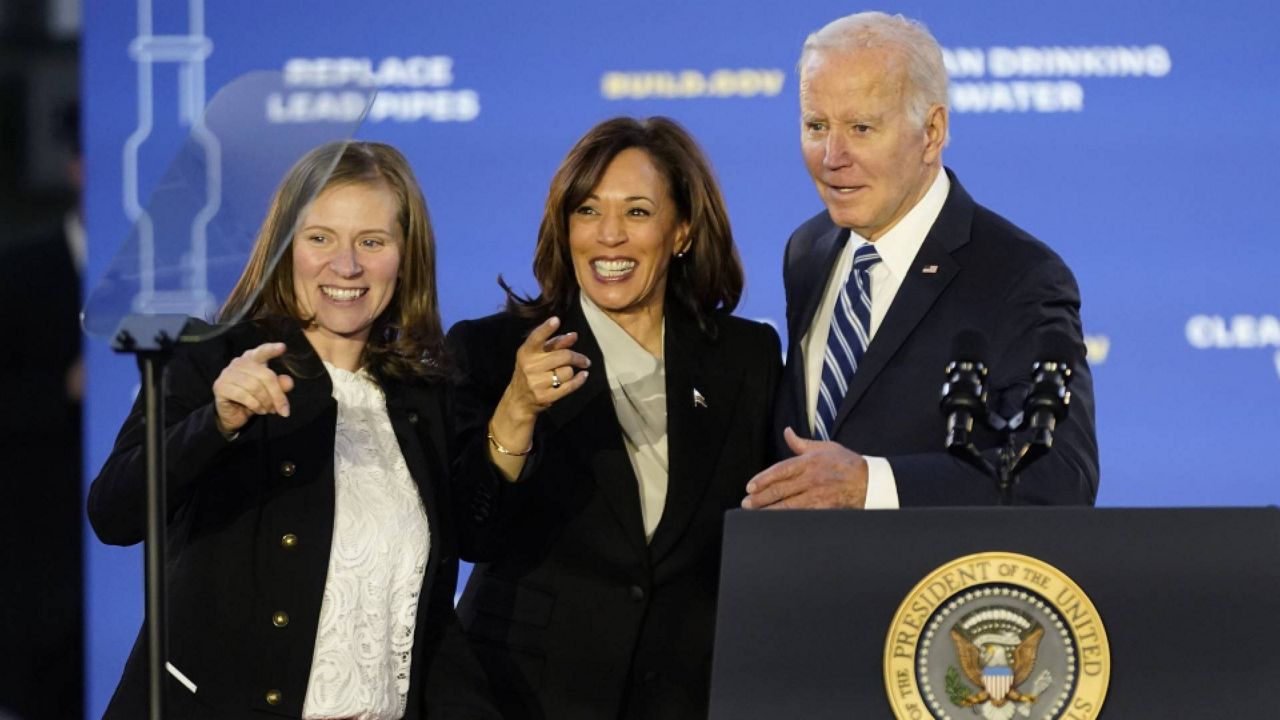 President Joe Biden stands on stage with Vice President Kamala Harris and Jana Curtis, founder of Get the Lead Out Riverwards, before he speaks about his infrastructure agenda while announcing funding to upgrade Philadelphia's water facilities and replace lead pipes, Friday, Feb. 3, 2023, at Belmont Water Treatment Center in Philadelphia. (AP Photo/Patrick Semansky)