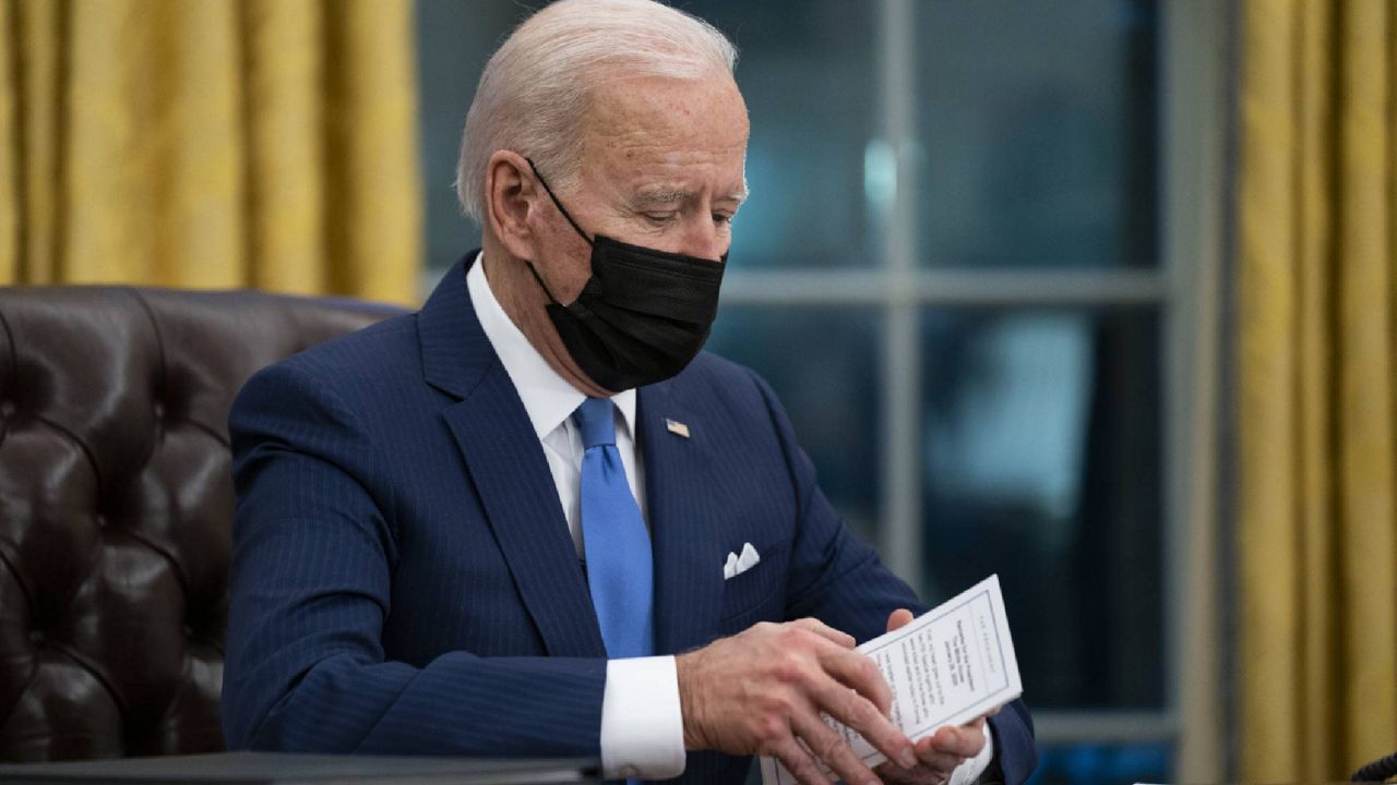 FILE - In this Feb. 2, 2021, file photo President Joe Biden delivers remarks on immigration, in the Oval Office of the White House in Washington. (AP Photo/Evan Vucci, File)
