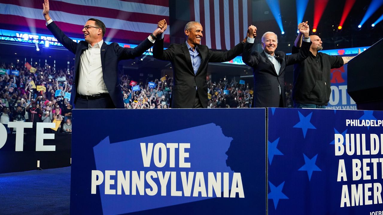 President Joe Biden arrives to speak at a campaign rally for Pennsylvania's Democratic gubernatorial candidate Josh Shapiro, left, Democratic Senate candidate Lt. Gov. John Fetterman, right, and former President Barack Obama, Saturday, Nov. 5, 2022, in Philadelphia. (AP Photo/Patrick Semansky)