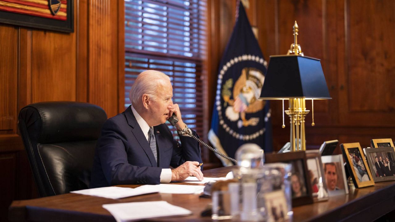 In this image provided by The White House, President Joe Biden speaks with Russian President Vladimir Putin from his Delaware home on Thursday Dec. 30, 2021.