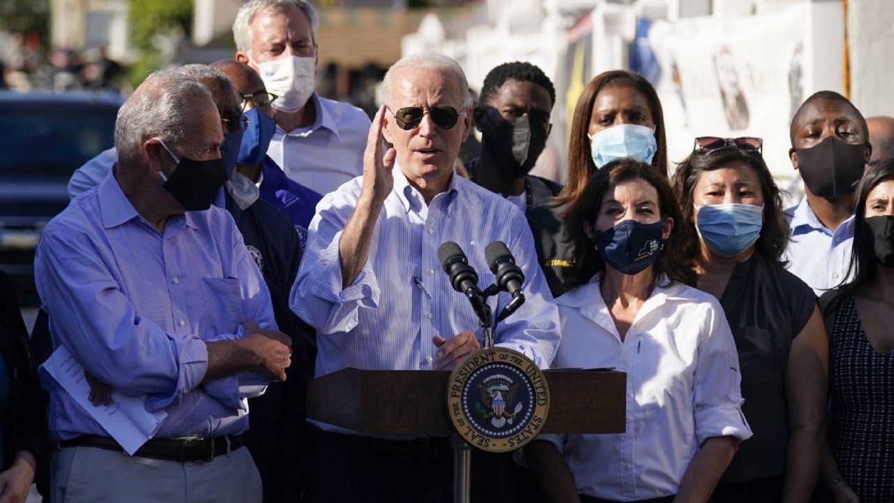 President Joe Biden speaks as he tours a neighborhood impacted by flooding from the remnants of Hurricane Ida, Tuesday, Sept. 7, 2021, in the Queens borough of New York. (AP Photo/Evan Vucci)