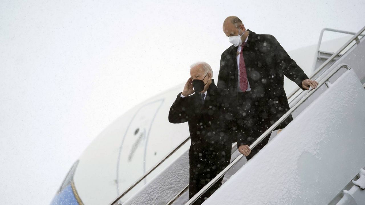 President Joe Biden arrives on Air Force One during winter snowstorm at Andrews Air Force Base, Md., Monday, Jan. 3, 2022. (AP Photo/Carolyn Kaster)