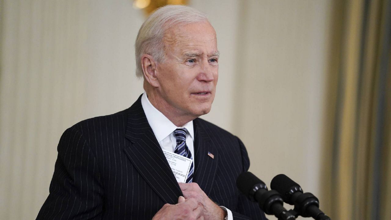 President Joe Biden delivers remarks about vaccinations, in the State Dining Room of the White House, Tuesday, April 6, 2021, in Washington. (AP Photo/Evan Vucci)