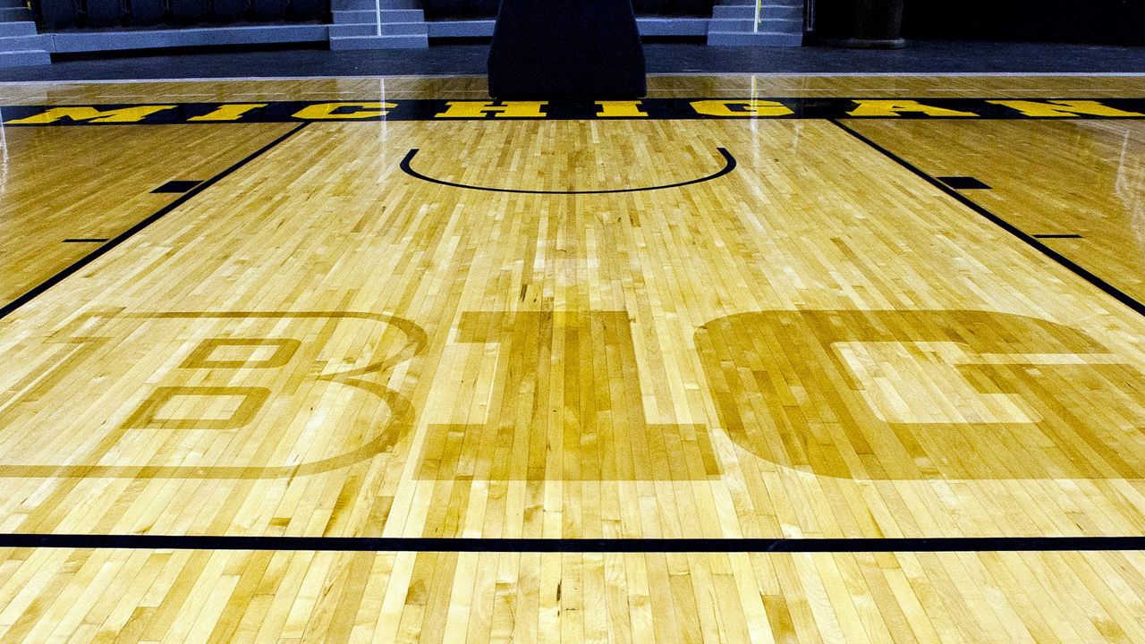 In this Oct. 11, 2011, file photo, the new Big Ten Conference logo "B1G" is stained into the wood of the newly-renovated Crisler Arena court during NCAA college basketball media day in Ann Arbor, Mich. (AP Photo/Tony Ding, File)