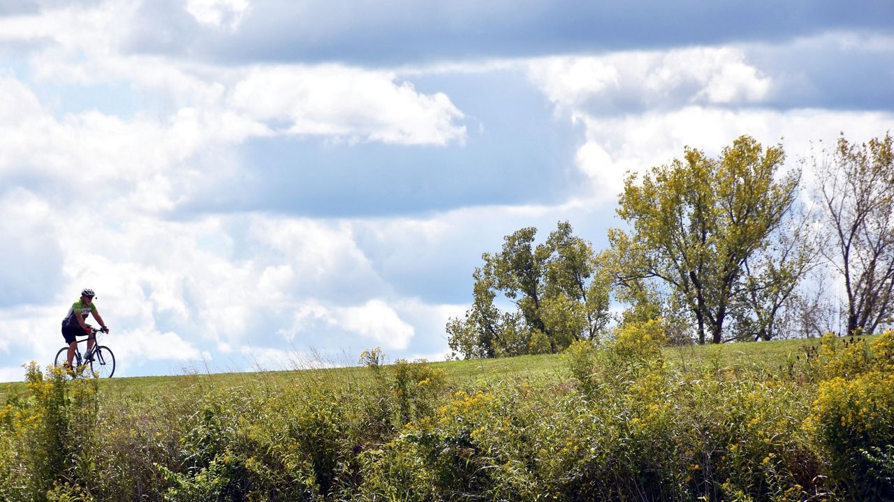 A cyclist rides a bike near Lunken Airport on Cincinnati's east side. (Casey Weldon/Spectrum News 1)