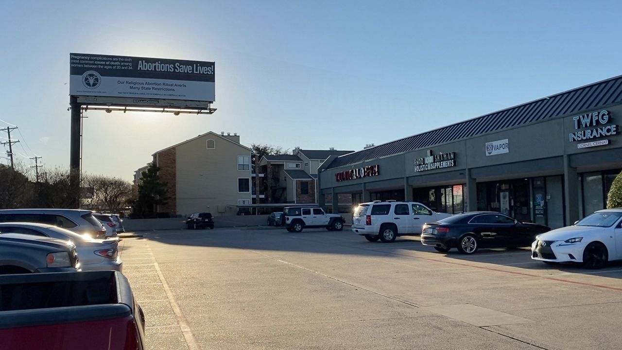 Billboard paid for by The Satanic Temple located off of Interstate 30 in Garland, Texas (Lupe Zapata/Spectrum News 1)