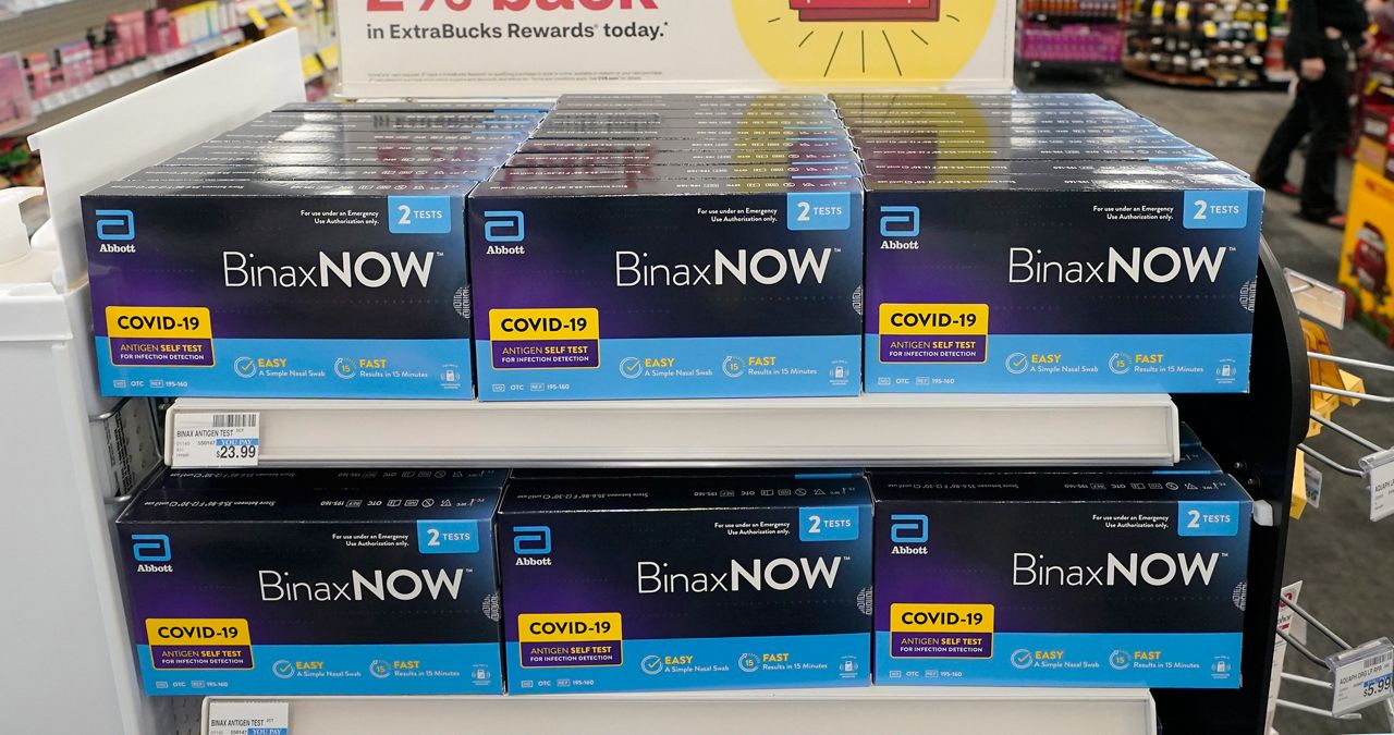 At home covid tests on a pharmacy shelf