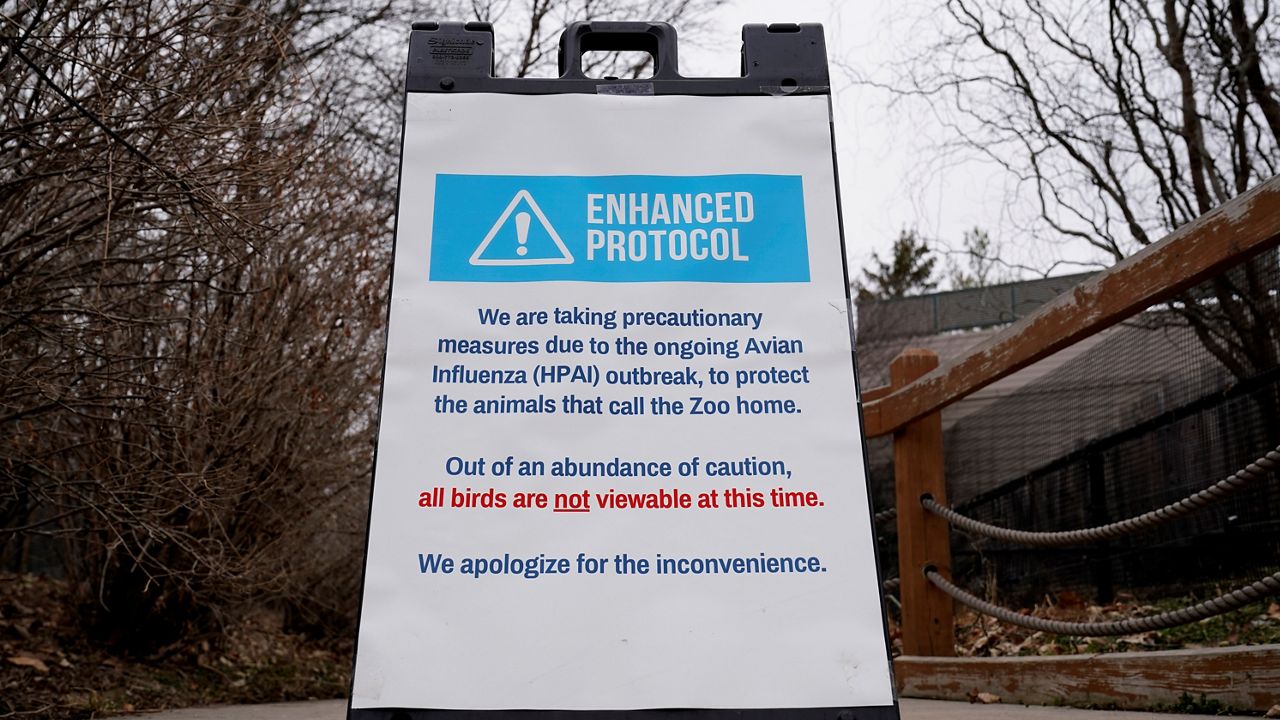 A sign is displayed instructing visitors of a closed bird exhibit at the Blank Park Zoo, Tuesday, April 5, 2022, in Des Moines, Iowa.