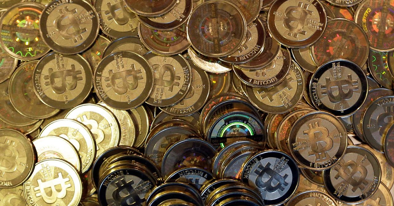 This April 3, 2013, file photo shows bitcoin tokens in Sandy, Utah. (AP Photo/Rick Bowmer, File)