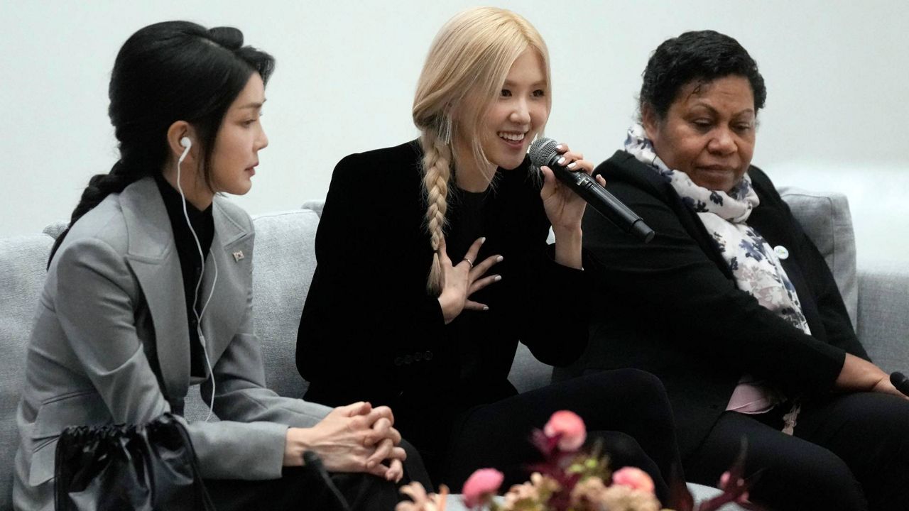 BLACKPINK musical performer Rosé, middle, speaks between Kim Keon Hee, first lady South Korea, left, and Rachael Marape, wife of Papua New Guinea's Prime Minister, during a discussion on mental health at a spousal program as part of the APEC Leaders' Week at the Apple campus in Cupertino, Calif., on Friday. (AP Photo/Jeff Chiu)