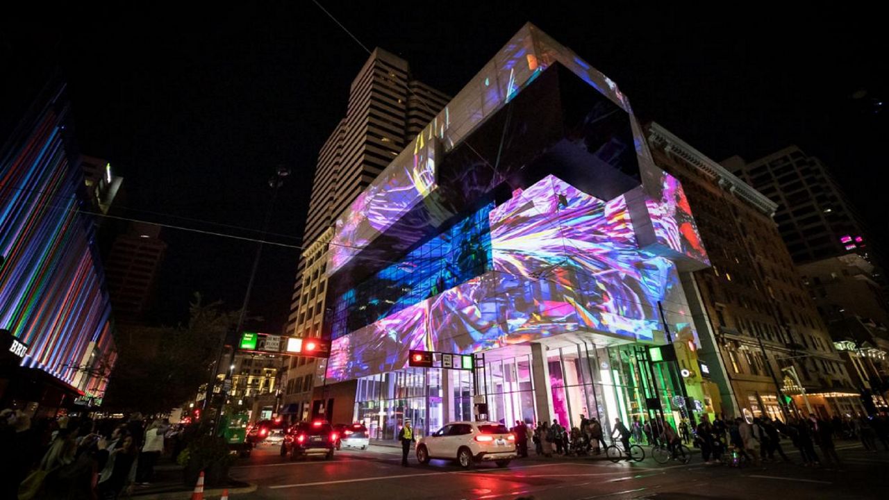 Projection mapping on the face of the Contemporary Arts Center in downtown Cincinnati during BLINK 2019. (Photo courtesy of BLINK)