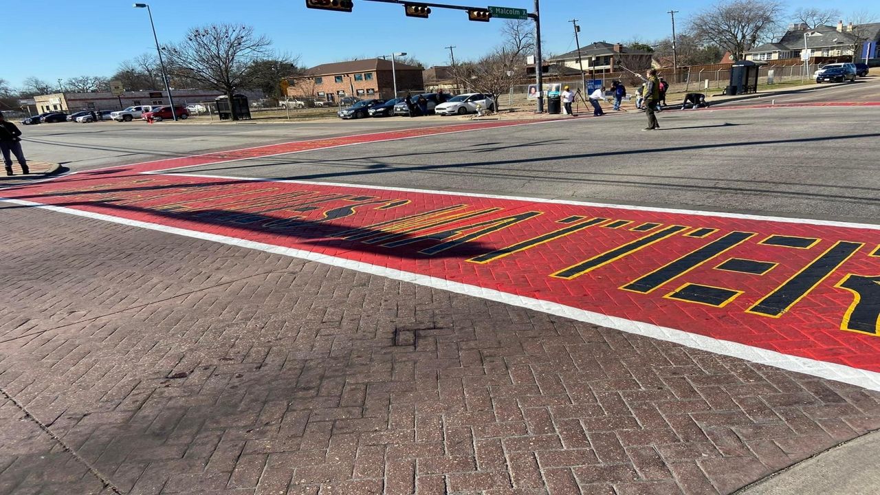 On Monday, city and community leaders gathered to showcase one of six 'All Black Lives Matter' crosswalks in South Dallas. (Spectrum News 1/City of Dallas)