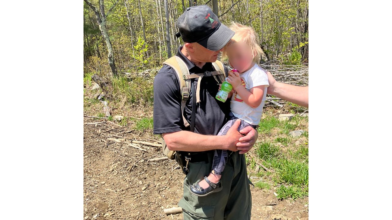 A Maine Game Warden and dog located a missing two-year-old girl in Jay on Tuesday. (Maine Department of Inland Fisheries and Wildlife)