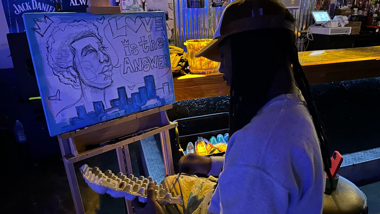 Artist at the There's Good in Ybor community rally at The Crowbar on Monday. (Spectrum News/Eddie Jackson)