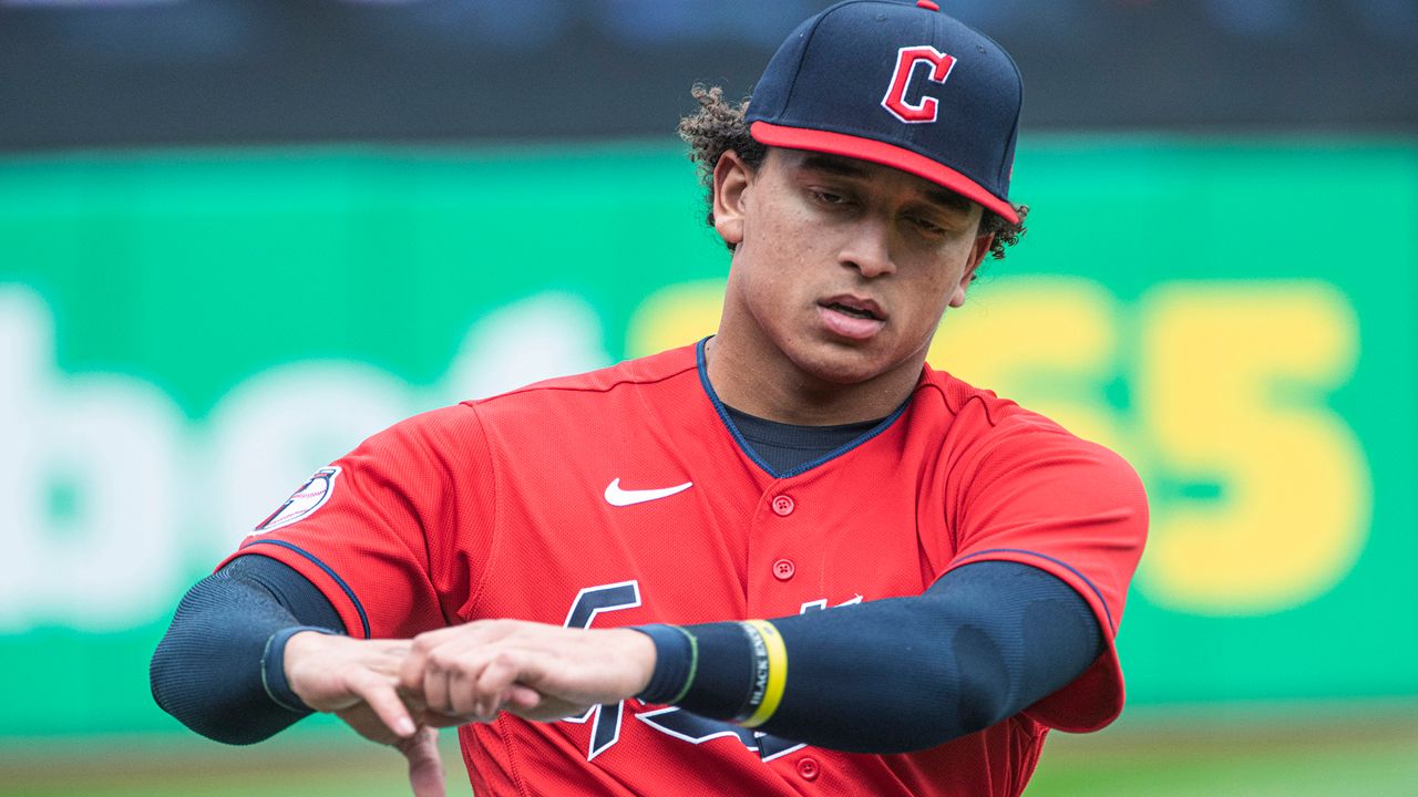 Cleveland Guardians' Bo Naylor warms up before the team's baseball game against the Kansas City Royals in Cleveland, Oct. 2, 2022. The Guardians called up catching prospect Naylor on Saturday, June 17, one day after they designated Mike Zunino for assignment. (AP Photo/Phil Long)