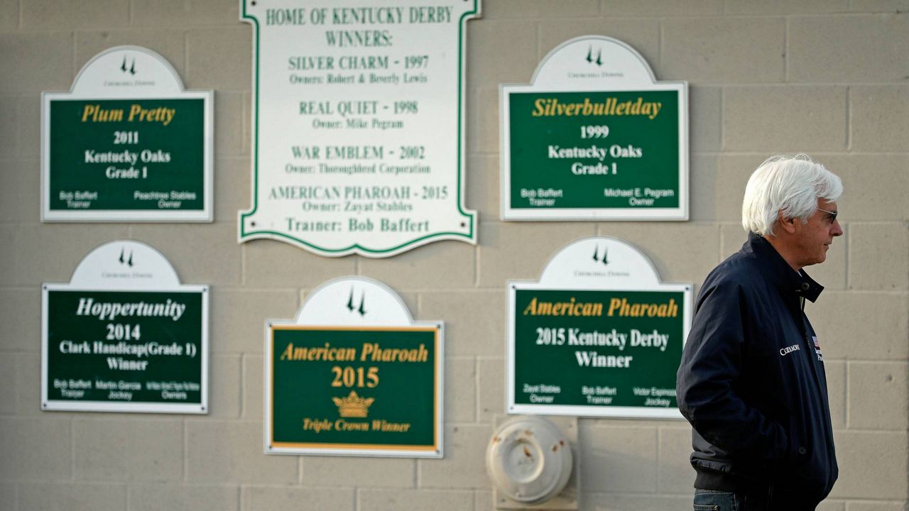 Trainer Bob Baffert stands outside his barn at Churchill Downs Monday, May 2, 2016, in Louisville, Ky. Medina Spirit was stripped of the victory in last years Kentucky Derby and Mandaloun was declared the winner in a ruling by state racing stewards on Monday, Feb. 21, 2022. (AP Photo/Charlie Riedel, FIle)