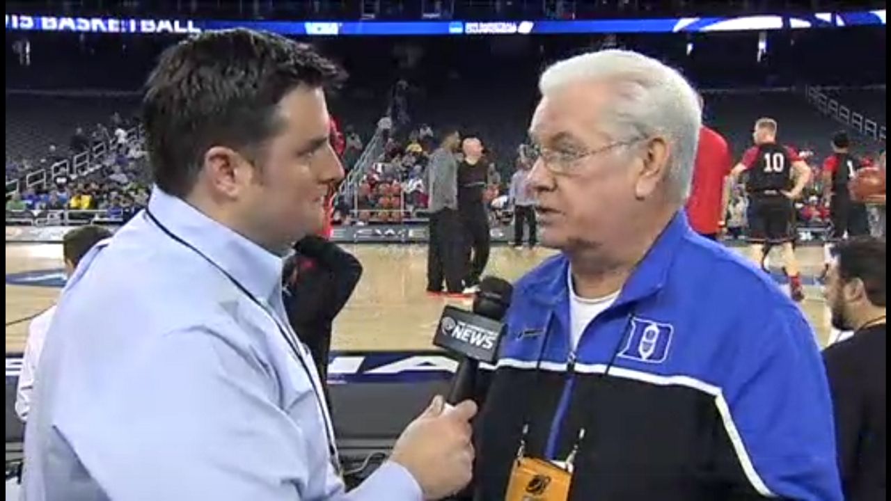 Duke sports radio play-by-play announcer Bob Harris speaks to a reporter as the Blue Devils prepare to face Utah in the Sweet 16 in Houston on March 27, 2015. (Spectrum News 1)