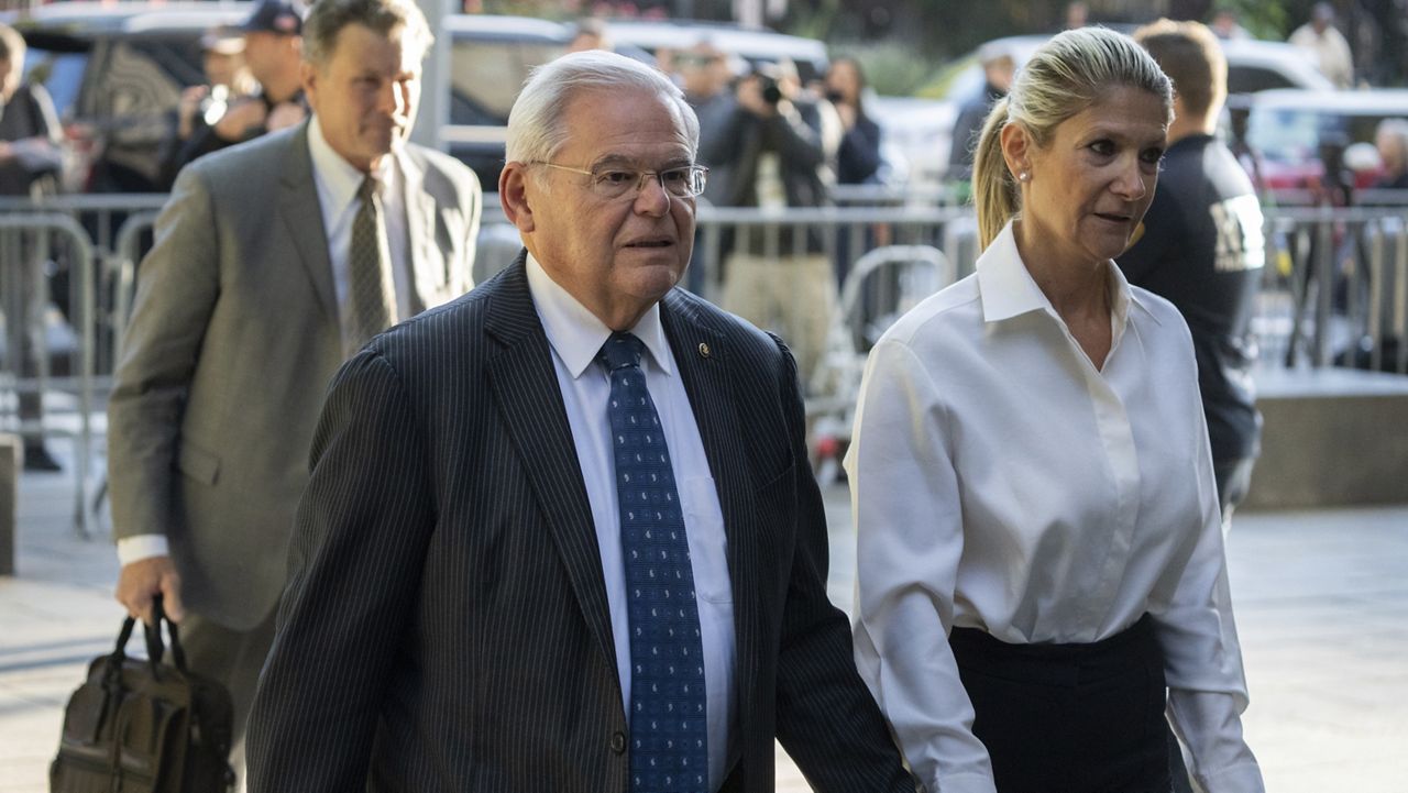 Democratic U.S. Sen. Bob Menendez of New Jersey, left, and his wife, Nadine Menendez, arrive at the federal courthouse in New York, Sept. 27, 2023. (AP Photo/Jeenah Moon, File)