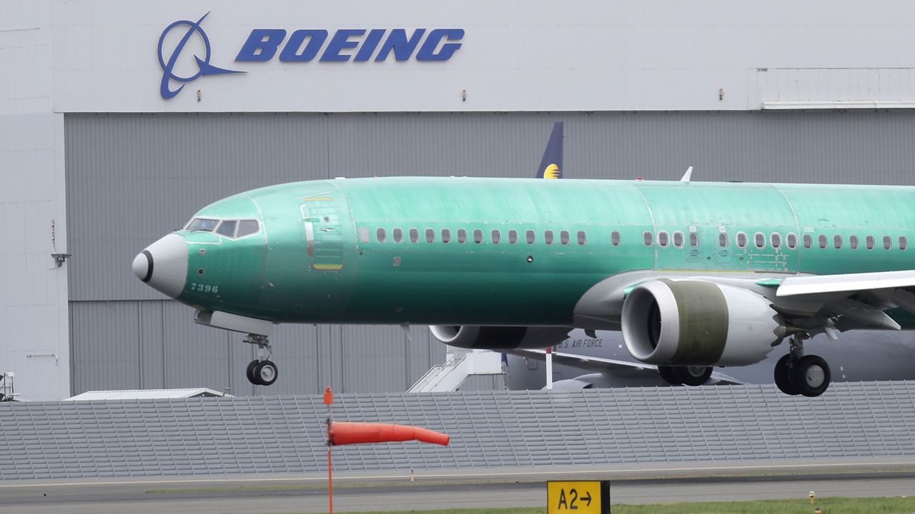 In this April 10, 2019, file photo, a Boeing 737 Max 8 airplane lands following a test flight at Boeing Field in Seattle. (AP Photo/Ted S. Warren, File)