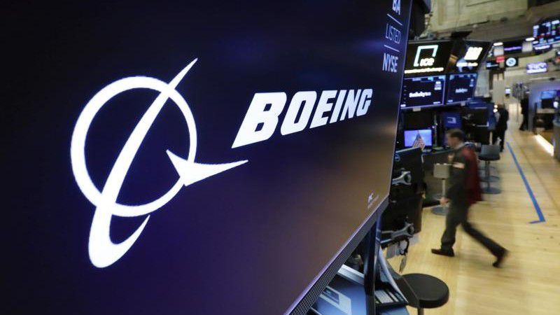 FILE - In this March 11, 2019 file photo, the Boeing logo appears above a trading post on the floor of the New York Stock Exchange before the opening bell. (AP Photo/Richard Drew, File)