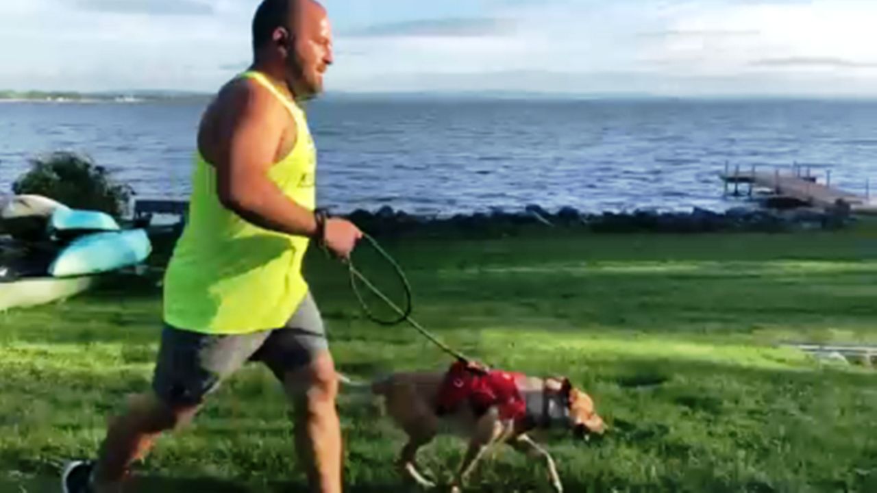 Tony Kapps runs with his dog Darwin