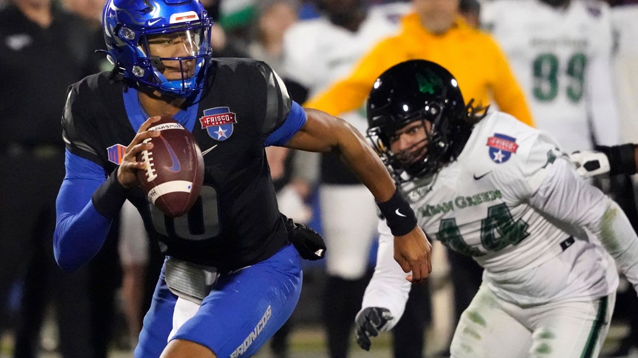 Boise State quarterback Taylen Green (10) runs from North Texas linebacker Mazin Richards (44) during the first quarter of the Frisco Bowl NCAA college football game Saturday, Dec. 17, 2022, in Frisco, Texas. (AP Photo/LM Otero)