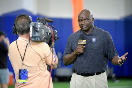 SEC Network analyst Booger McFarland, right, broadcasts during Florida's NFL Pro Day in Gainesville, Fla. (AP Photo/Phelan M. Ebenhack, File)