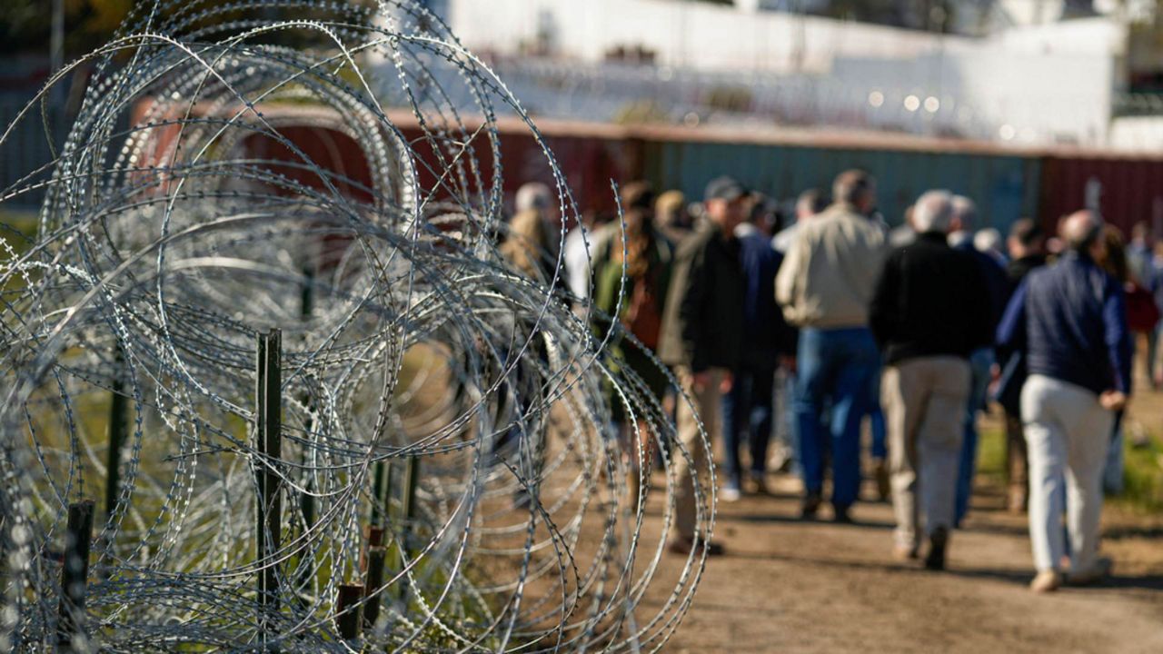 Concertina wire lines the path as members of Congress tour an area near the Texas-Mexico border, Jan. 3, 2024, in Eagle Pass, Texas. (Associated Press/Eric Gay, File)