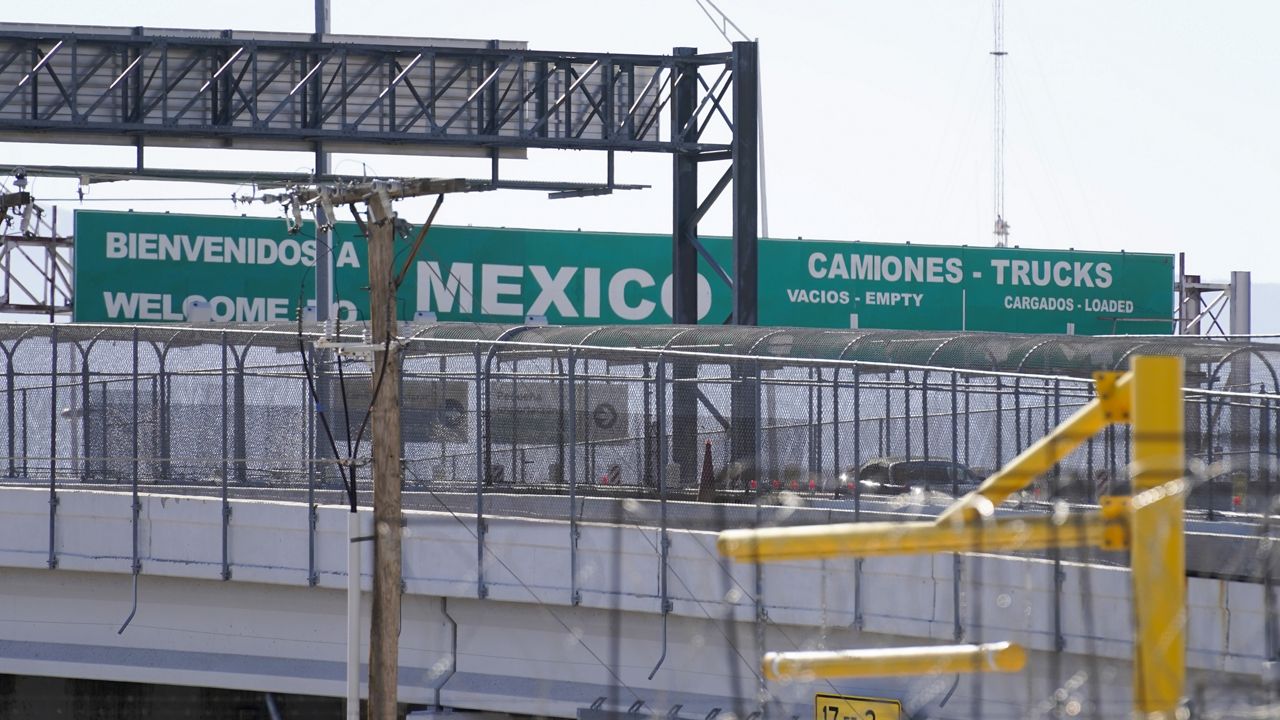 A large "Welcome to Mexico" sign that is hung over the Bridge of the Americas is visible along the U.S.-Mexico border in El Paso Texas, Sunday, Jan. 8, 2023. (AP Photo/Andrew Harnik)