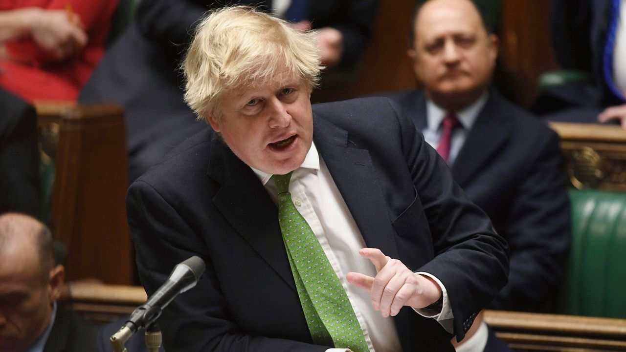 In this handout photo provided by the U.K. Parliament, Britain's Prime Minister Boris Johnson updates the House of Commons on the latest situation in Ukraine on Tuesday. (Jessica Taylor/UK Parliament via AP)