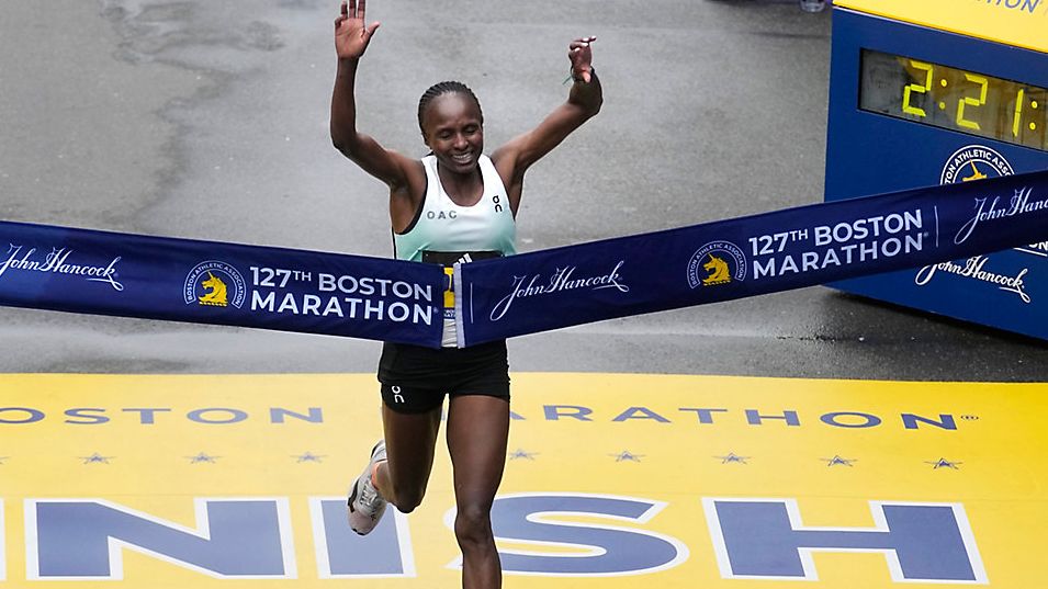 Hellen Obiri, of Kenya, breaks the tape at the finish line to win the women's division of the Boston Marathon, Monday, April 17, in Boston. (AP Photo/Charles Krupa)