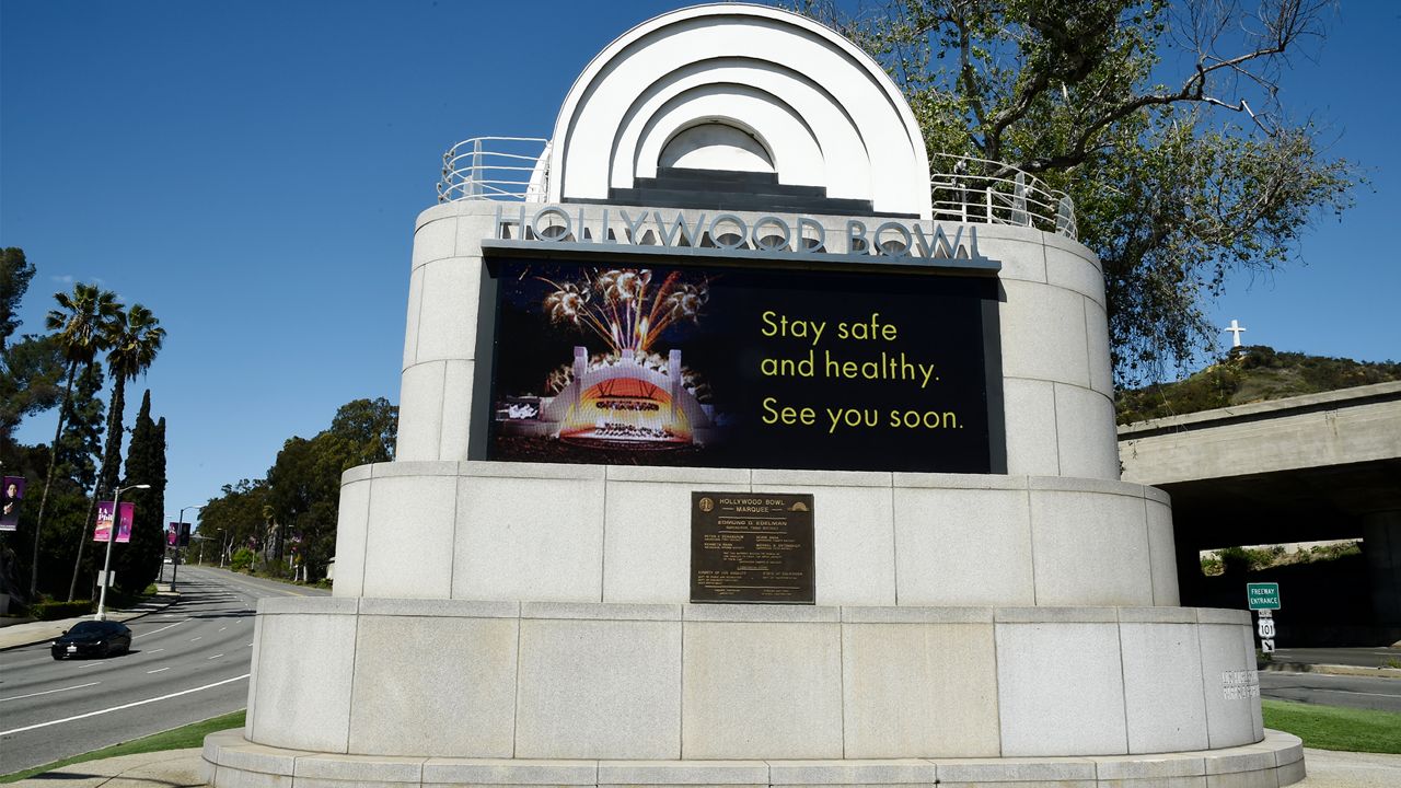 A video monitor at the entrance to the Hollywood Bowl concert venue bears a coronavirus-related message, Friday, March 27, 2020, in Los Angeles. (AP Photo/Chris Pizzello)
