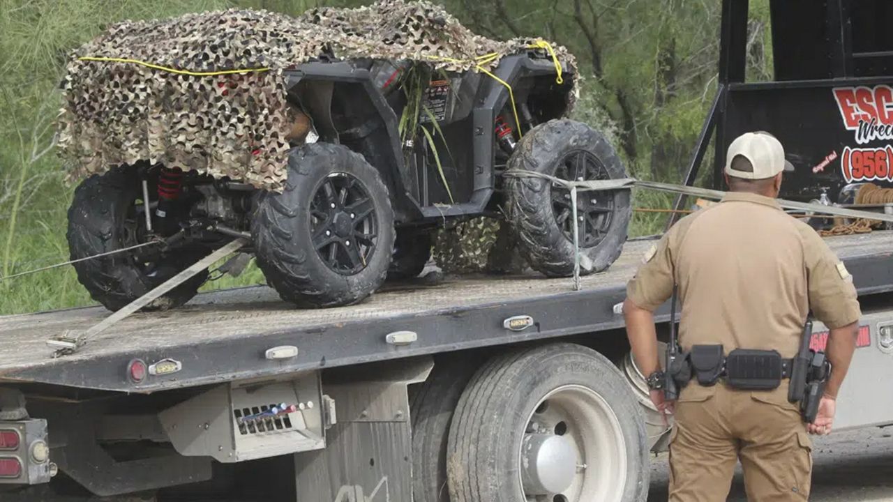 An ATV vehicle is removed from the scene where an off duty border patrol agent was killed on Wednesday Dec. 7, 2022 in Mission, Texas. (Delcia Lopez/The Monitor via AP)