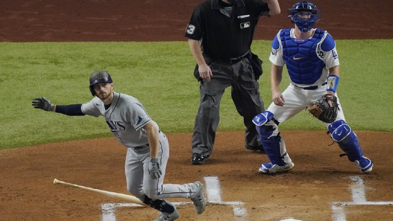 Tampa Bay Rays' Brandon Lowe hits a home run against the Los Angeles Dodgers during the first inning in Game 2 of the baseball World Series Wednesday, Oct. 21, 2020, in Arlington, Texas. (AP Photo/Eric Gay)