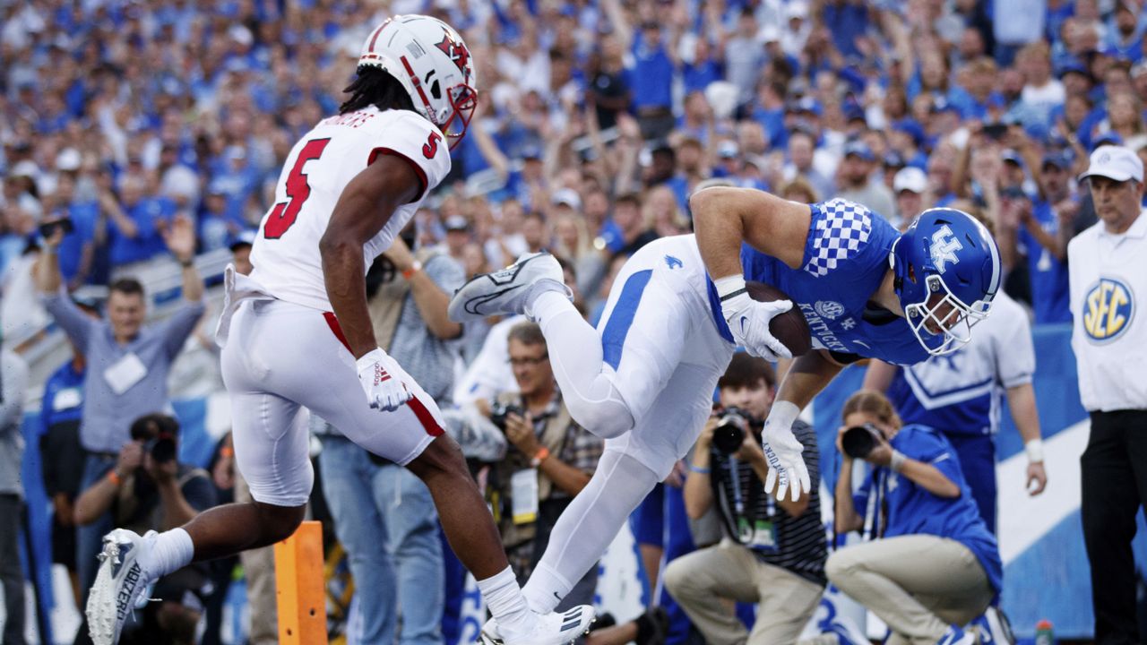 Kentucky tight end Brenden Bates, right, falls into the end zone for a touchdown during the first half of the team's NCAA college football game against Miami (Ohio) in Lexington, Ky., Saturday, Sept. 3, 2022. (AP Photo/Michael Clubb)