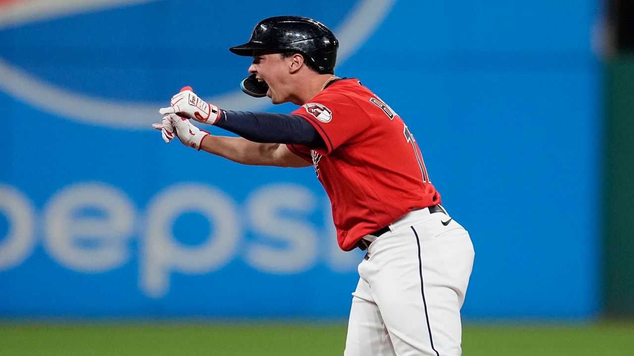 Cleveland Guardians' Will Brennan celebrates at second base after hitting a double against the Detroit Tigers during the eighth inning in the second baseball game of a doubleheader Friday, Aug. 18, 2023, in Cleveland. (AP Photo/Sue Ogrocki)