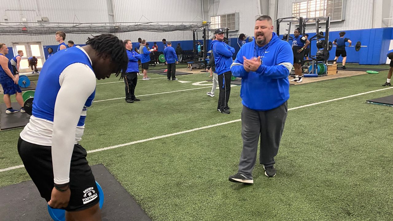 Brewer High School strength and conditioning coach, Brian Stansberry, trains football team during the off-season. (Spectrum News/Chris Grisby)