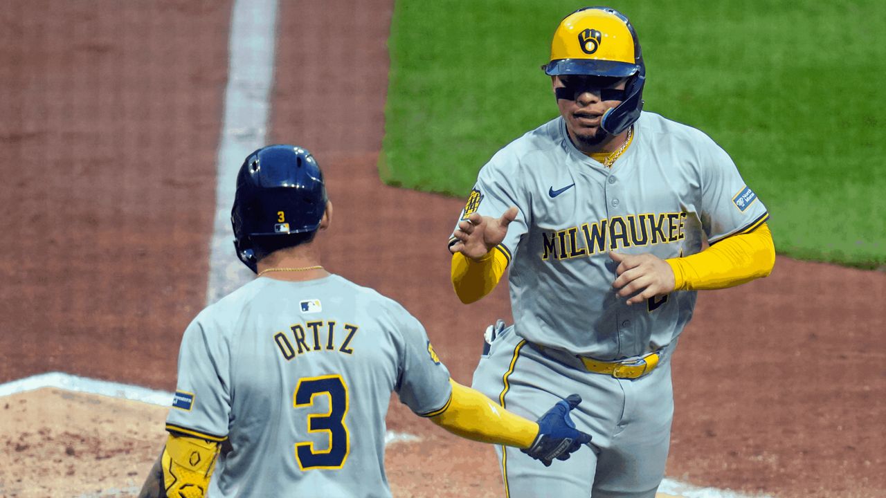 Milwaukee Brewers' William Contreras is greeted by Joey Ortiz 