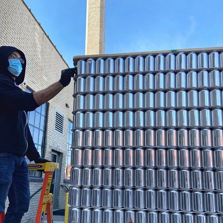 Brian Jackson marking cans outside Esoteric Brewing in Walnut Hills (Provided)