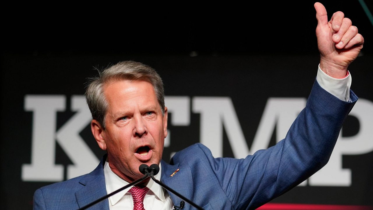 Republican Gov. Brian Kemp waves to supporters during an election night watch party on May 24, 2022 in Atlanta. (AP Photo/John Bazemore)