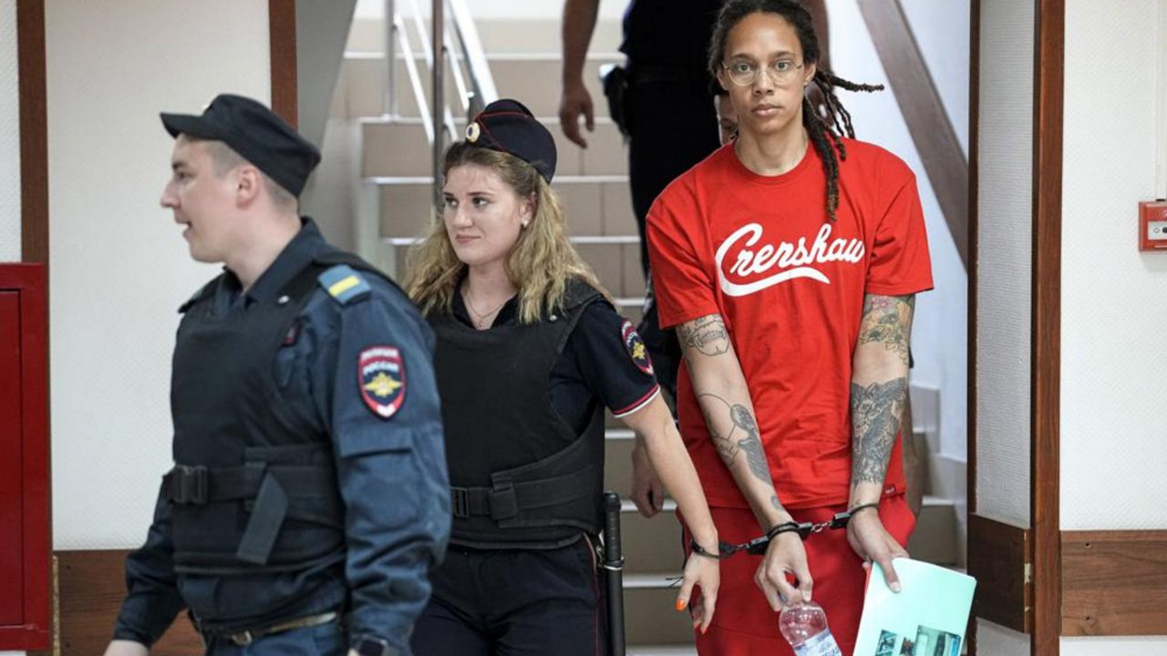 WNBA star and two-time Olympic gold medalist Brittney Griner is escorted to a courtroom for a hearing in Khimki just outside Moscow, on July 7, 2022. Russia has freed WNBA star Brittney Griner on Thursday in a dramatic high-level prisoner exchange, with the U.S. releasing notorious Russian arms dealer Viktor Bout. (AP Photo/Alexander Zemlianichenko, File)