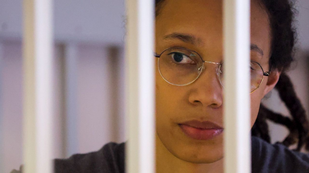 WNBA star Brittney Griner looks through bars Thursday as she listens to the verdict while standing in a cage in a courtroom in Khimki, just outside Moscow, Russia. (Evgenia Novozhenina/Pool Photo via AP)