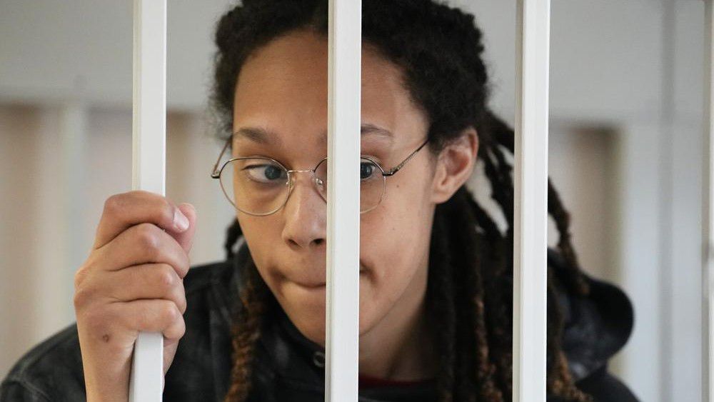 WNBA star and two-time Olympic gold medalist Brittney Griner stands in a cage at a court room prior to a hearing, in Khimki just outside Moscow, Russia, Tuesday, July 26, 2022. American basketball star Brittney Griner has returned to a Russian courtroom for her drawn-out trial on drug charges that could bring her 10 years in prison if convicted. (AP Photo/Alexander Zemlianichenko, Pool)