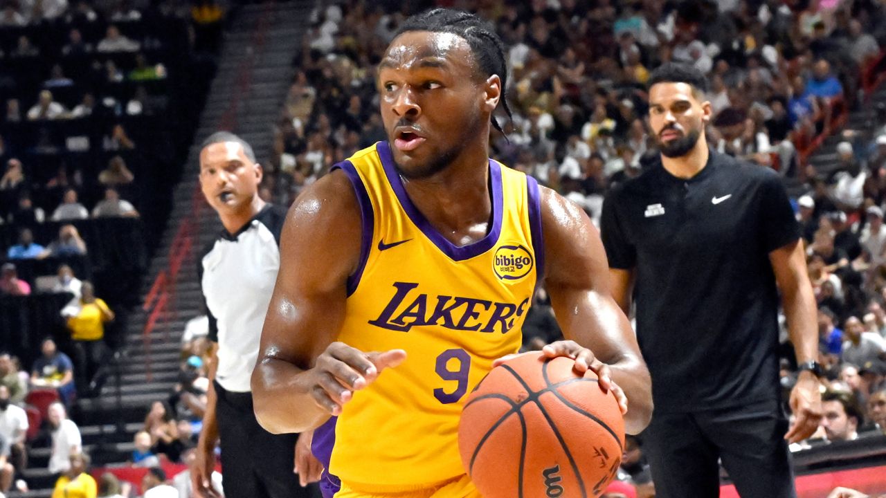 Los Angeles Laker guard Bronny James Jr. (9) drives the ball against the Houston Rockets during the first half of an NBA summer league basketball game Friday in Las Vegas. (AP Photo/David Becker)