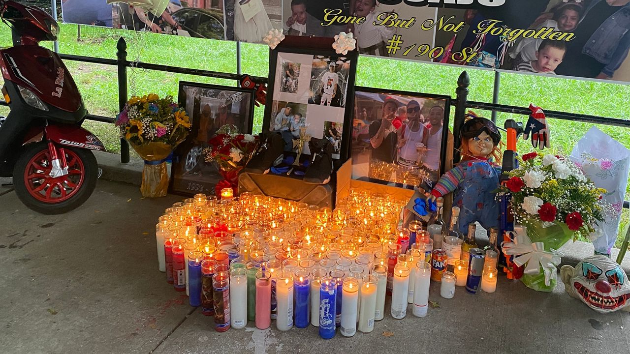 Mourners set up a memorial for Eric Duprey at the site of where he died.