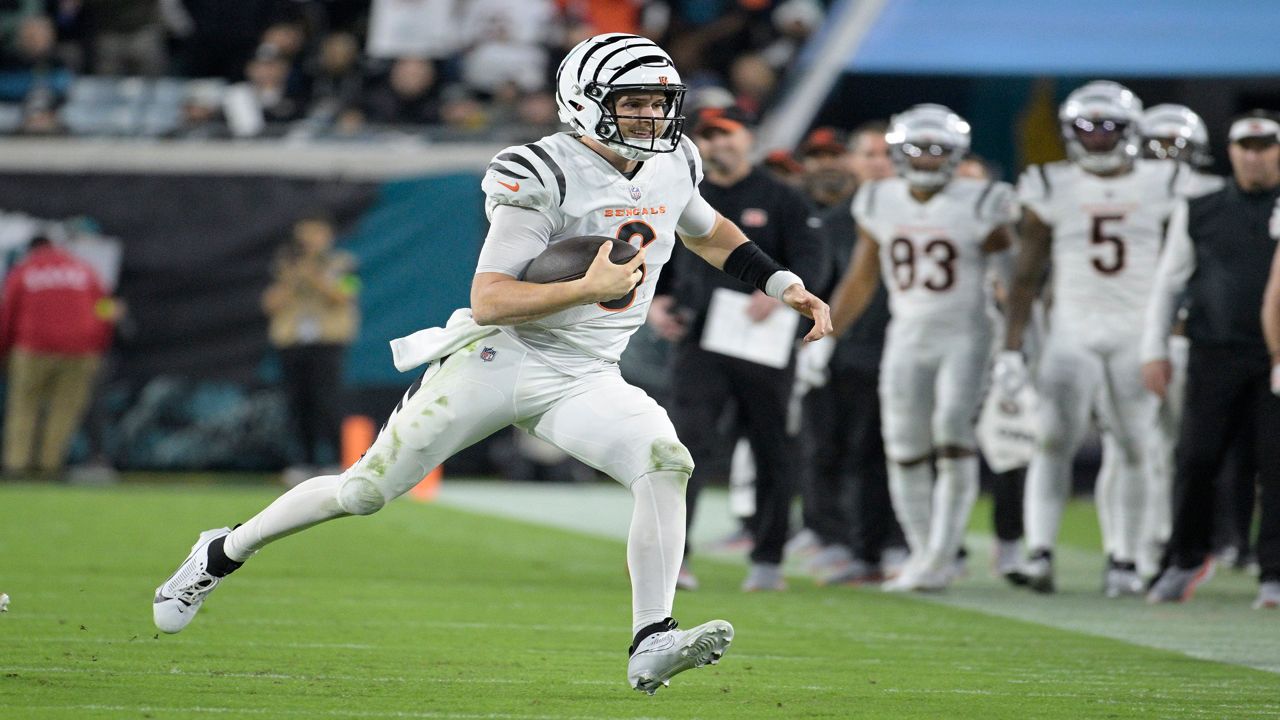 Cincinnati Bengals quarterback Jake Browning (6) runs with the football during the second half of an NFL football game against the Jacksonville Jaguars, Monday, Dec. 4, 2023, in Jacksonville, Fla. (AP Photo/Phelan M. Ebenhack)