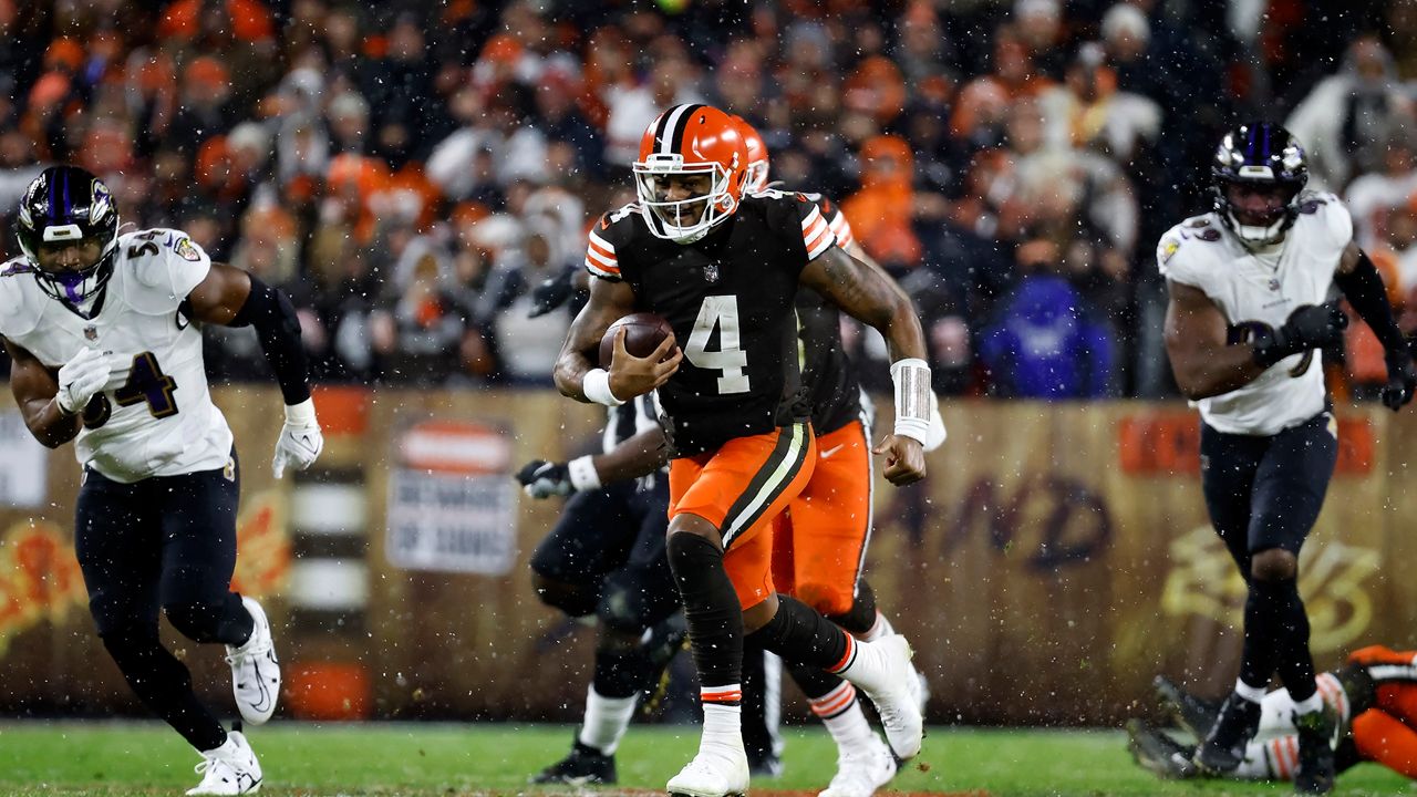 Cleveland Browns quarterback Deshaun Watson (4) runs with the ball during an NFL football game against the Baltimore Ravens, Saturday, Dec. 17, 2022, in Cleveland. (AP Photo/Kirk Irwin)