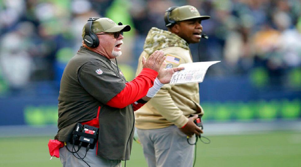 Tampa Bay Buccaneers head coach Bruce Arians, left, calls to his team during the second half of an NFL football game against the Seattle Seahawks, Sunday, Nov. 3, 2019, in Seattle. (AP Photo/Scott Eklund)