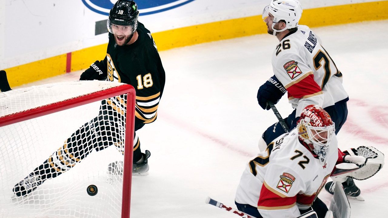 Boston Bruins center Pavel Zacha (18) celebrates after defeating Florida Panthers goaltender Sergei Bobrovsky (72) on the winning goal during an overtime period of an NHL hockey game, Monday, Oct. 30, 2023, in Boston. (AP Photo/Charles Krupa)