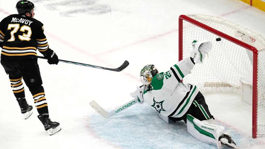 Boston Bruins defenseman Charlie McAvoy (73) backhands a shot past Dallas Stars goalie Jake Oettinger in a shootout during NHL hockey game, Monday, Feb. 19, 2024, in Boston. (AP Photo/Charles Krupa)